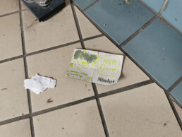 Mondays postcard crumpled on the ground